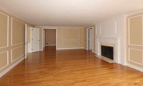 17 Aspen Road Weston, MA 02493 - Photo 5 of 27 a view of empty room with wooden floor and fireplace