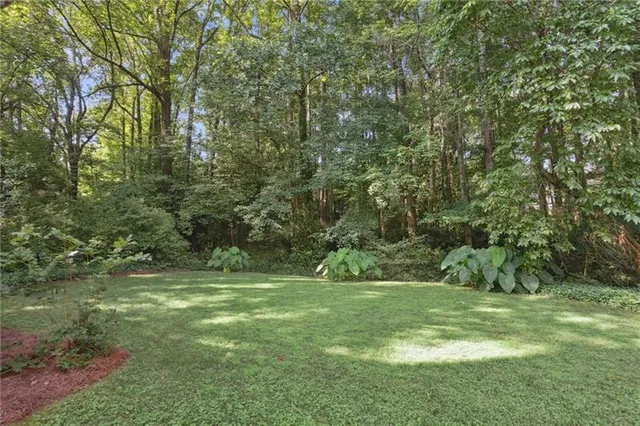 a balcony with trees in front of it