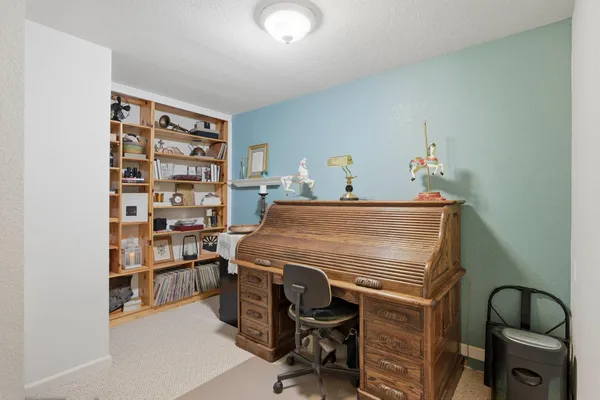 a view of a house with backyard sitting area and garden