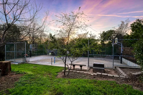 a view of a backyard with sitting area
