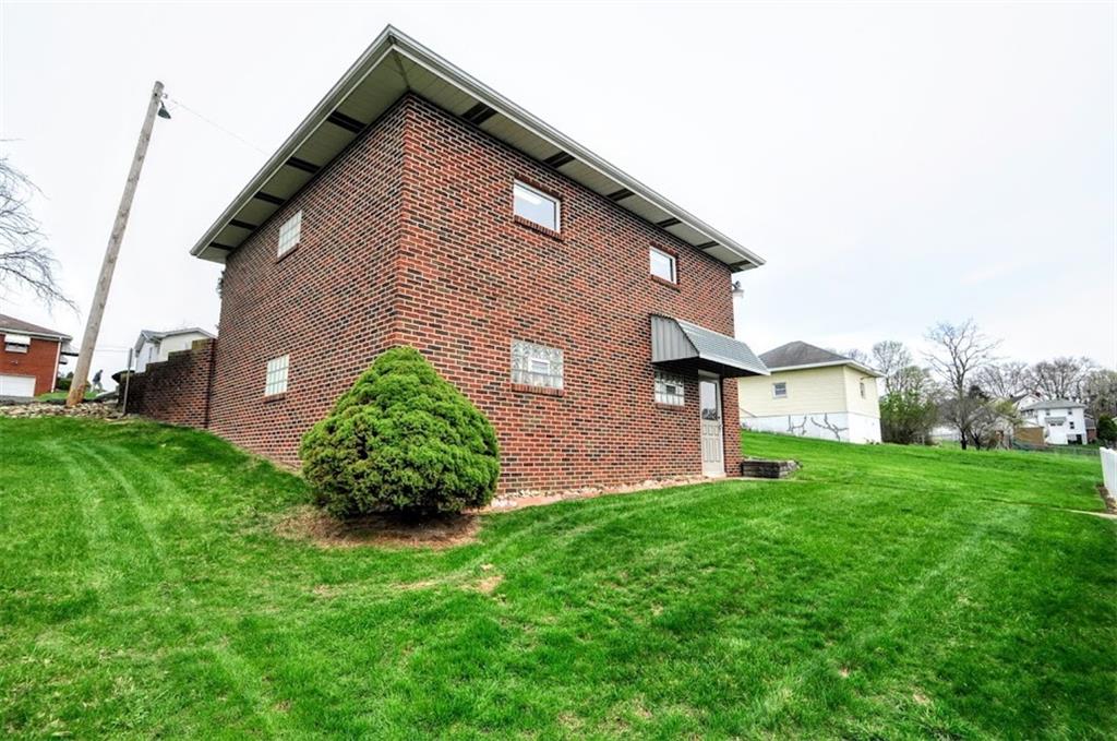 65 Cort Street Washington, PA 15301 - Photo 20 of 49 a backyard of a house with lots of green space