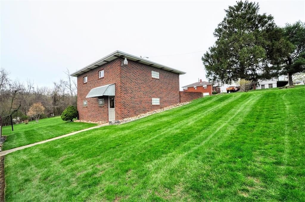 65 Cort Street Washington, PA 15301 - Photo 21 of 49 a front view of a house with garden
