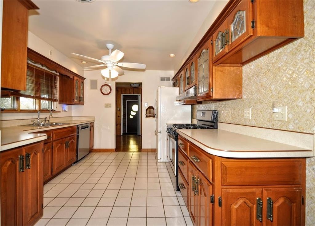 65 Cort Street Washington, PA 15301 - Photo 27 of 49 a kitchen with stainless steel appliances granite countertop a sink and cabinets