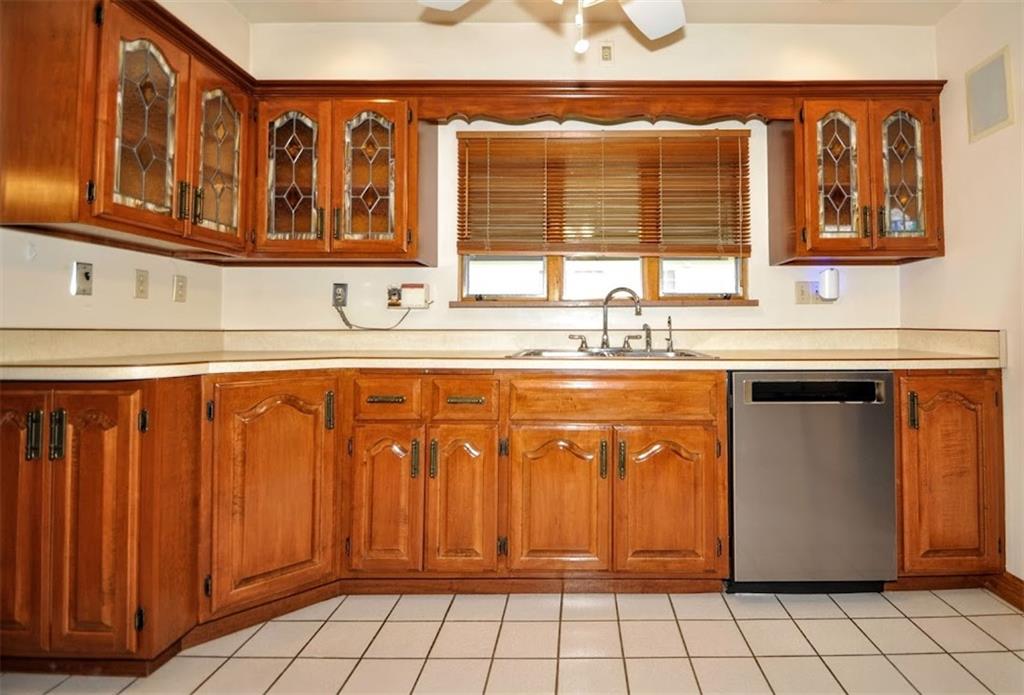 65 Cort Street Washington, PA 15301 - Photo 28 of 49 a kitchen with stainless steel appliances granite countertop a sink and cabinets