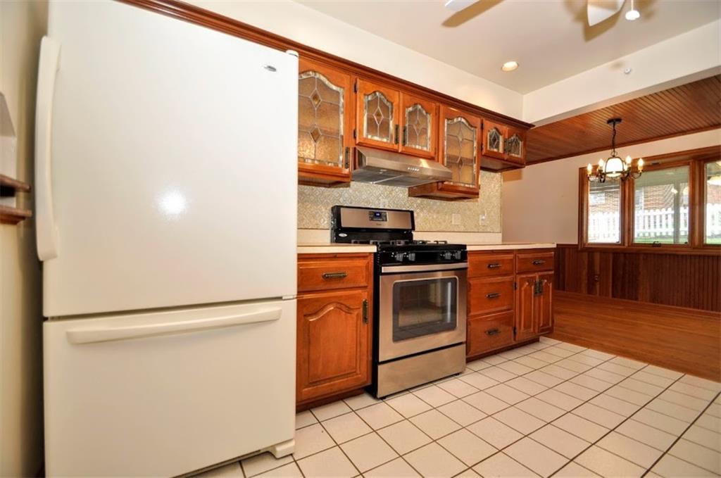 65 Cort Street Washington, PA 15301 - Photo 29 of 49 a kitchen with stainless steel appliances granite countertop a refrigerator and a stove top oven