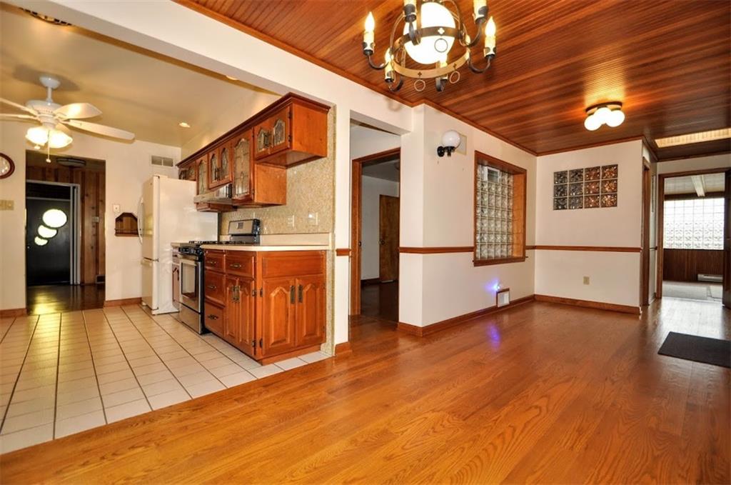 65 Cort Street Washington, PA 15301 - Photo 30 of 49 a open kitchen with stainless steel appliances granite countertop a refrigerator a stove and a wooden floors