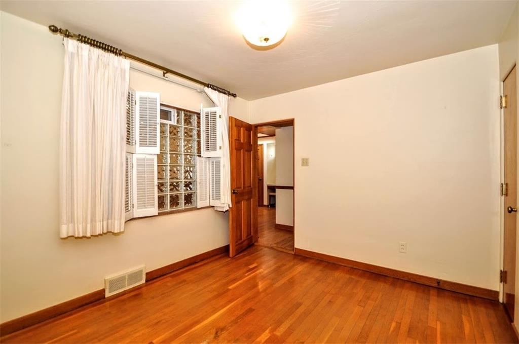65 Cort Street Washington, PA 15301 - Photo 36 of 49 a view of an empty room with wooden floor and a window