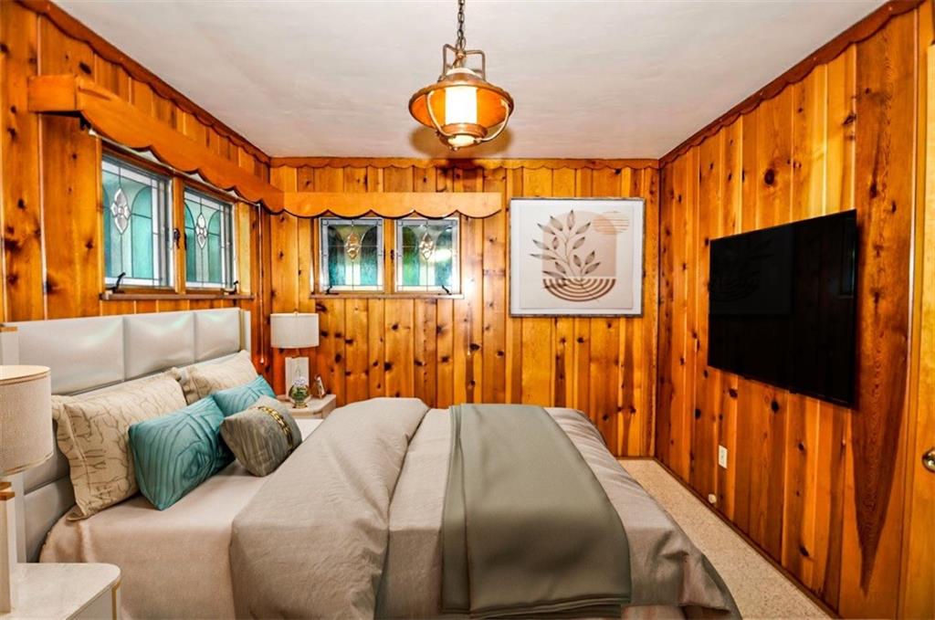 65 Cort Street Washington, PA 15301 - Photo 37 of 49 a bedroom with furniture and a flat screen tv