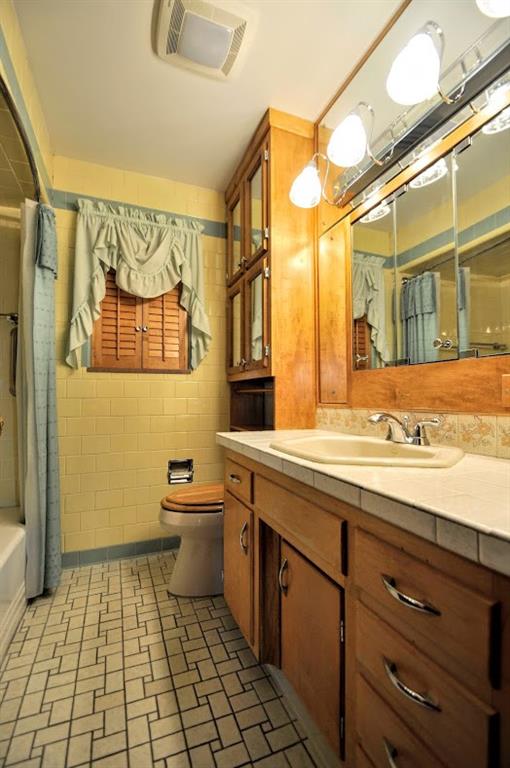 65 Cort Street Washington, PA 15301 - Photo 42 of 49 a bathroom with a sink a toilet and a mirror