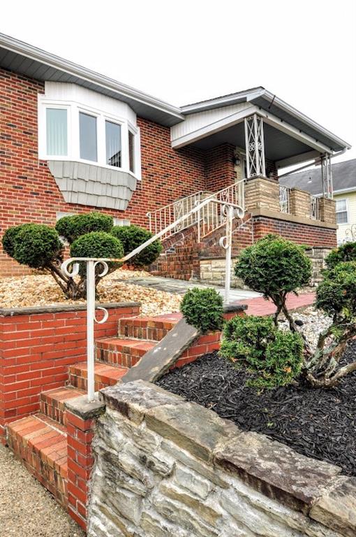 65 Cort Street Washington, PA 15301 - Photo 5 of 49 a front view of a house with plants
