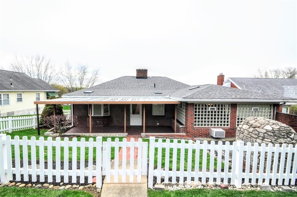 65 Cort Street Washington, PA 15301 - Photo 7 of 49 a front view of a house with a garden
