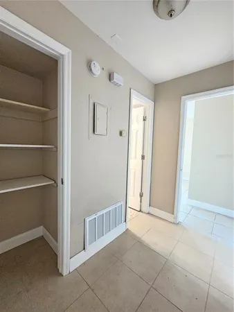 a view of a hallway with closet area