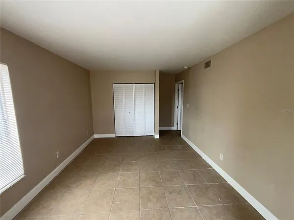 a view of an empty room and window