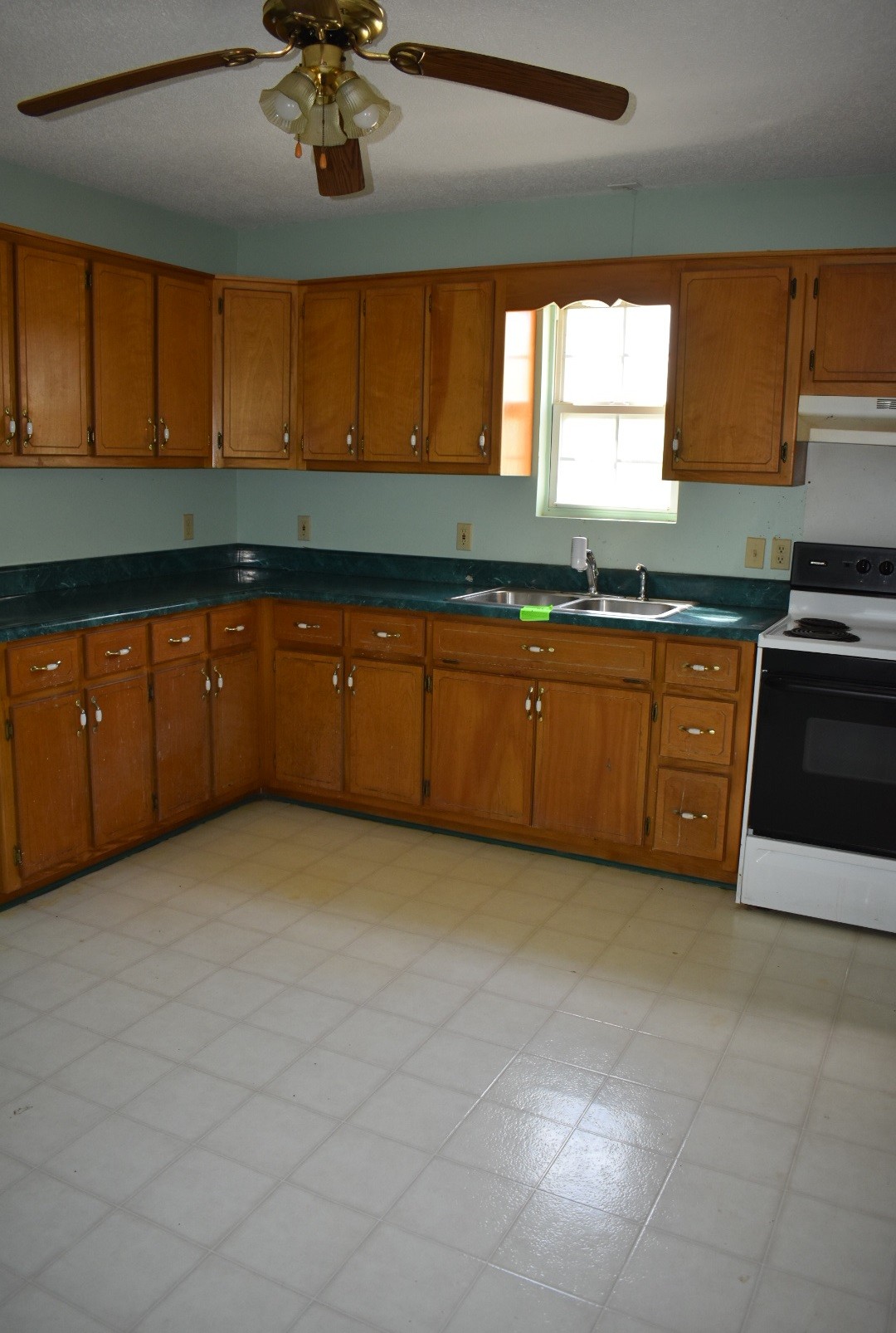 2174 Pleasant Hill Road Lynchburg, TN 37352 - Photo 16 of 16 a large kitchen with stainless steel appliances granite countertop a sink window and cabinets