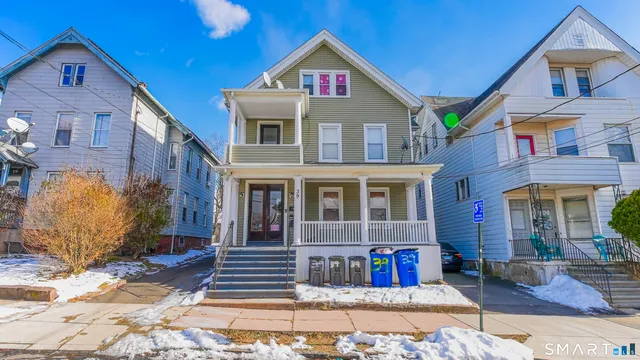 a view of a brick house with many windows