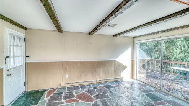 wooden floor with an entryway