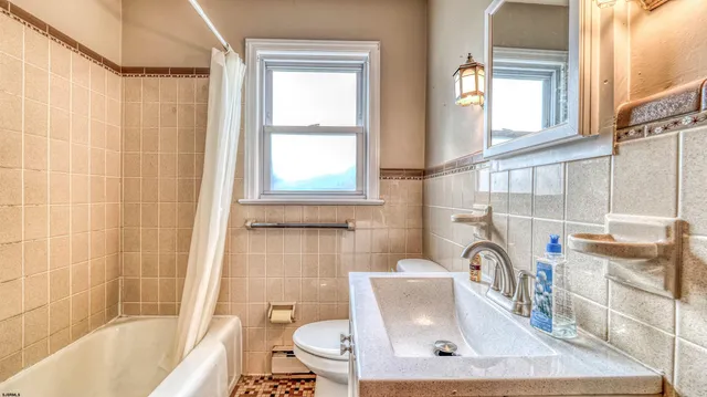 a bath tub sitting next to a window