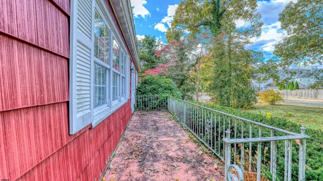 a balcony with trees in front of it