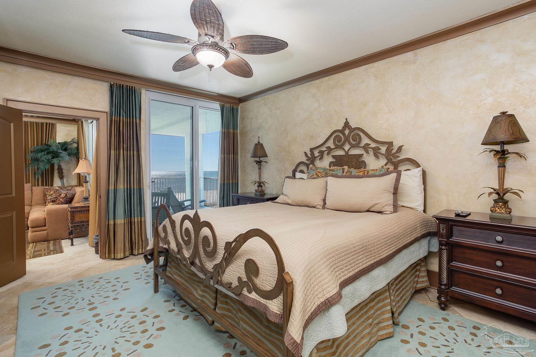 16795 Perdido Key Drive, Unit 40304B Perdido Key, FL 32507 - Photo 16 of 42 a bedroom with a bed and a chandelier
