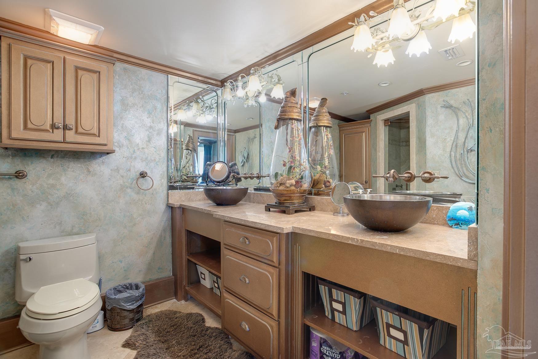 16795 Perdido Key Drive, Unit 40304B Perdido Key, FL 32507 - Photo 18 of 42 a bathroom with a sink a toilet and mirror