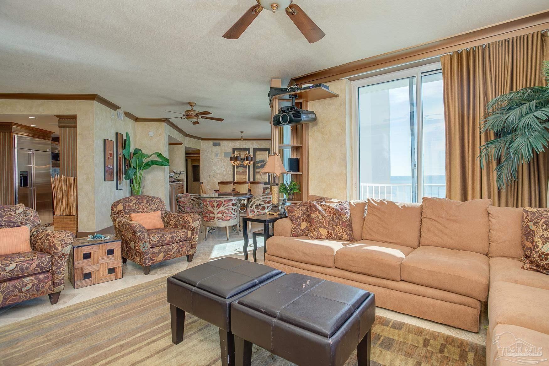 16795 Perdido Key Drive, Unit 40304B Perdido Key, FL 32507 - Photo 22 of 42 a living room with furniture and a large window