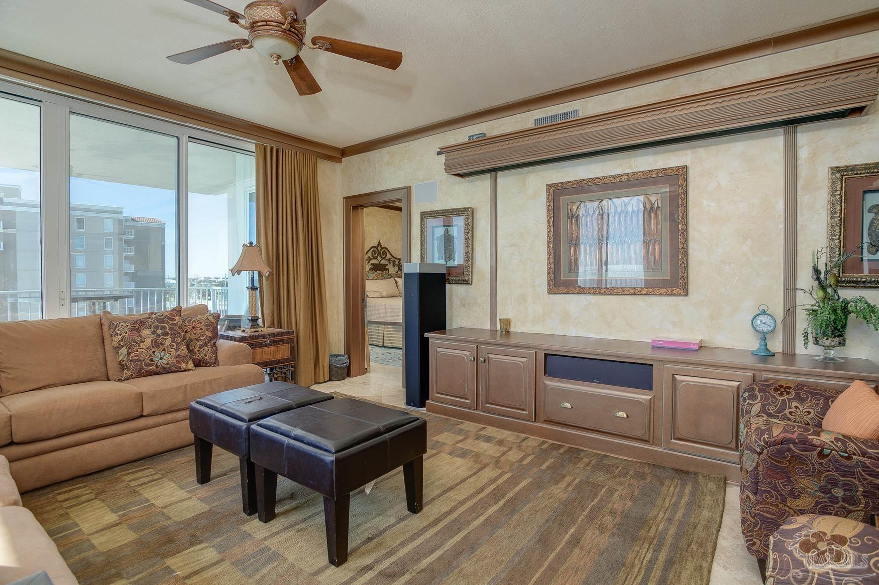 16795 Perdido Key Drive, Unit 40304B Perdido Key, FL 32507 - Photo 23 of 42 a living room with furniture and a wooden floor