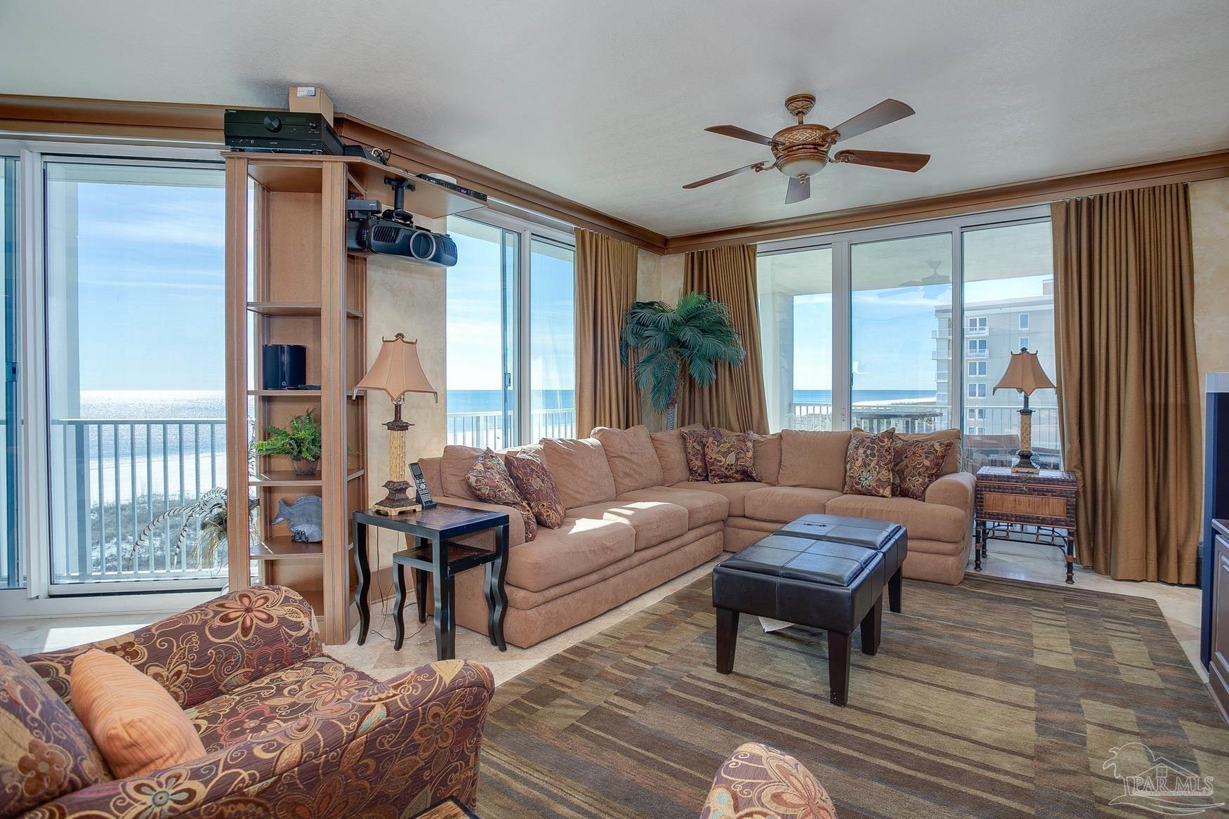 16795 Perdido Key Drive, Unit 40304B Perdido Key, FL 32507 - Photo 24 of 42 a living room with furniture and a large window