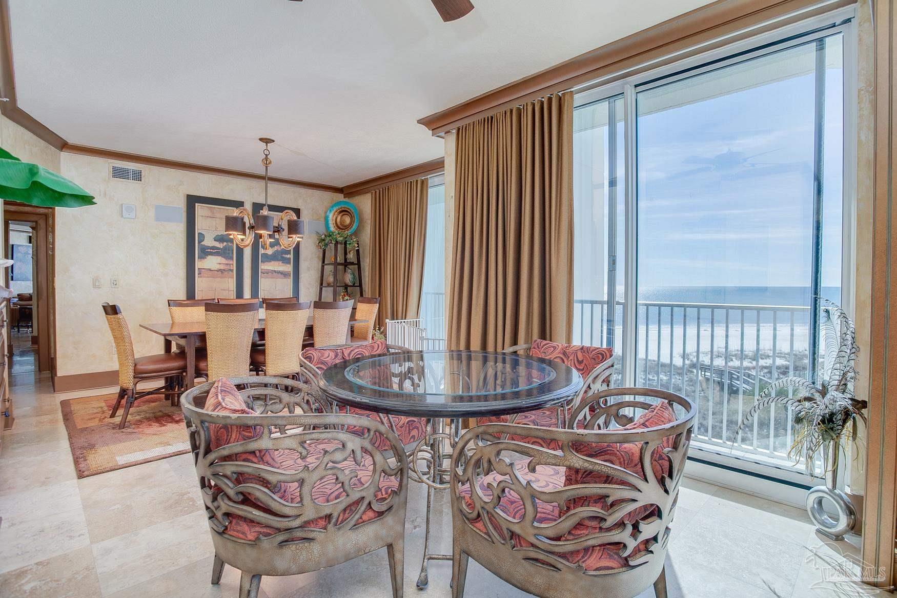 16795 Perdido Key Drive, Unit 40304B Perdido Key, FL 32507 - Photo 27 of 42 a dining room with furniture and window