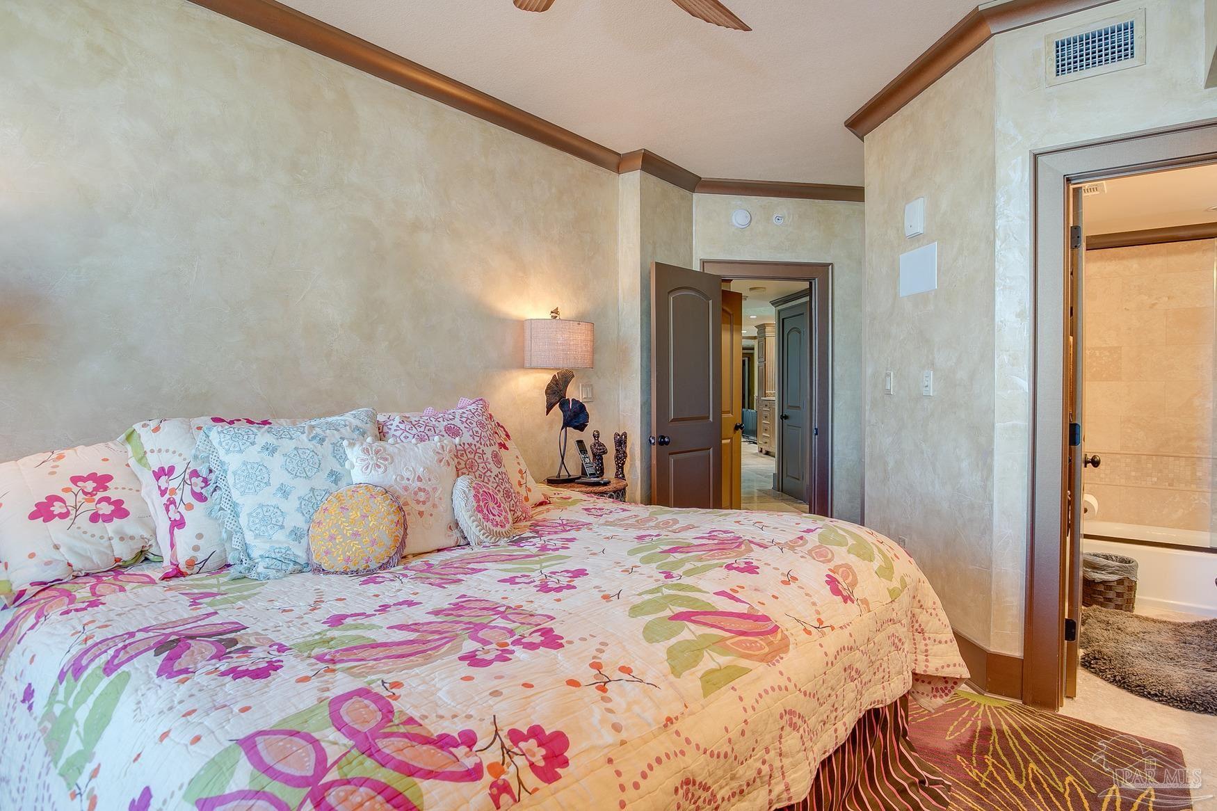 16795 Perdido Key Drive, Unit 40304B Perdido Key, FL 32507 - Photo 36 of 42 a bedroom with a bed and a mirror