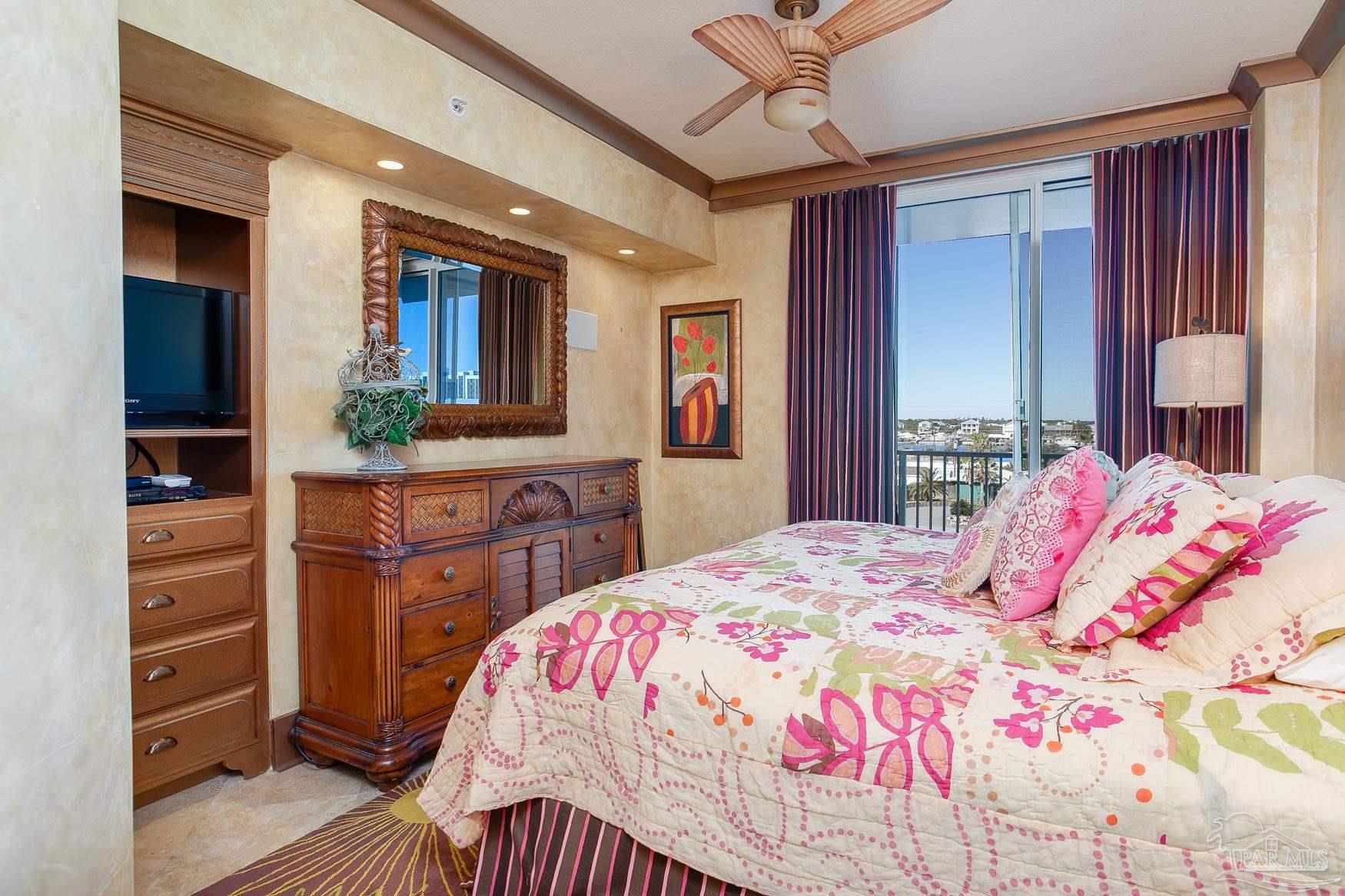 16795 Perdido Key Drive, Unit 40304B Perdido Key, FL 32507 - Photo 37 of 42 a bedroom with a bed and a dresser