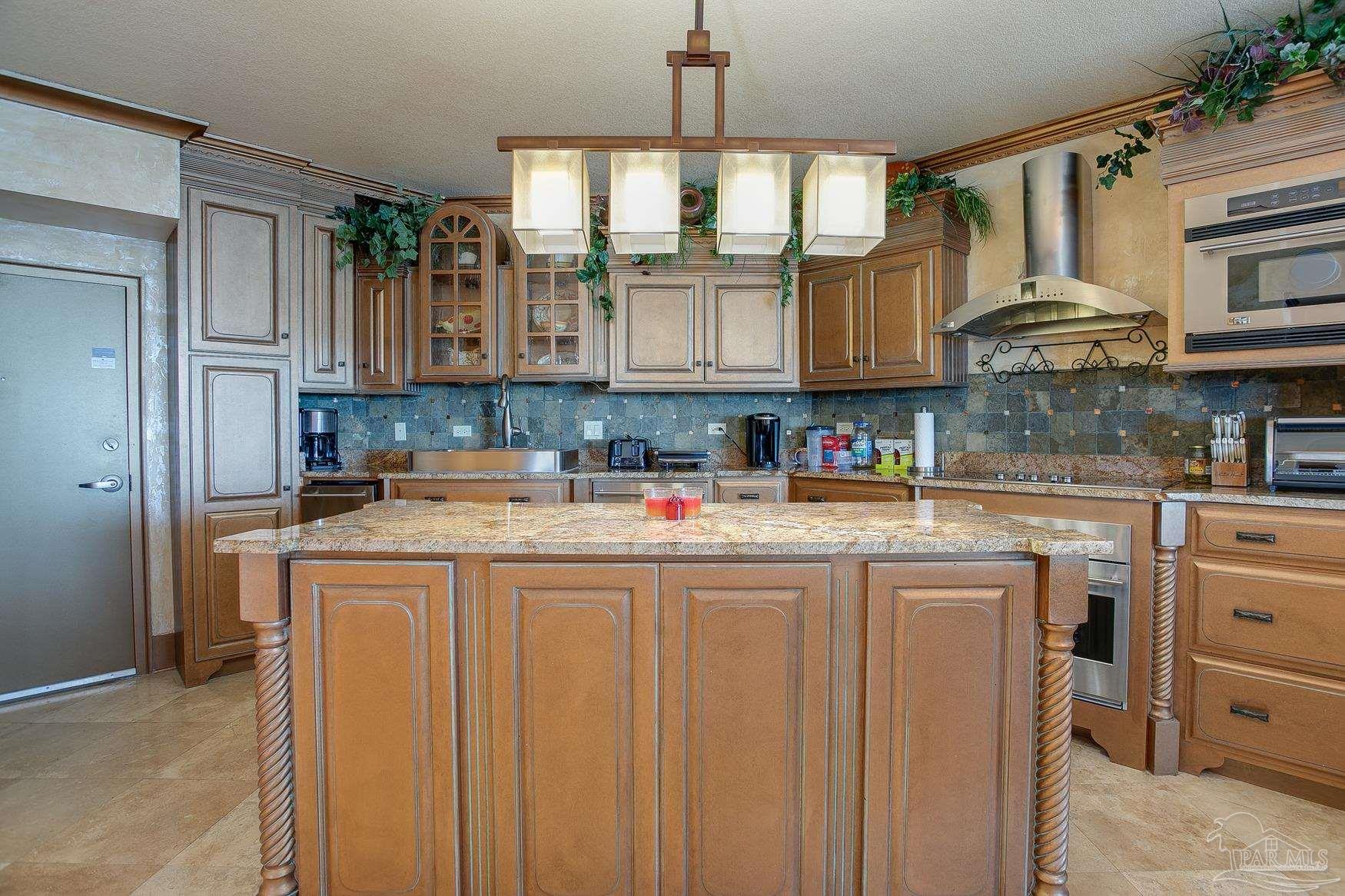 16795 Perdido Key Drive, Unit 40304B Perdido Key, FL 32507 - Photo 7 of 42 a kitchen with stainless steel appliances granite countertop a sink and cabinets