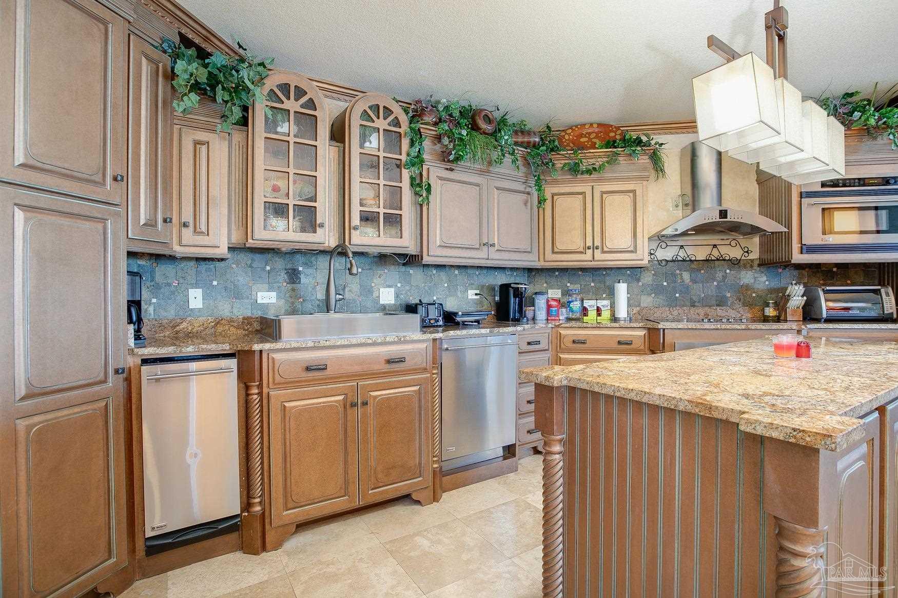 16795 Perdido Key Drive, Unit 40304B Perdido Key, FL 32507 - Photo 9 of 42 a kitchen with stainless steel appliances granite countertop a sink stove and cabinets