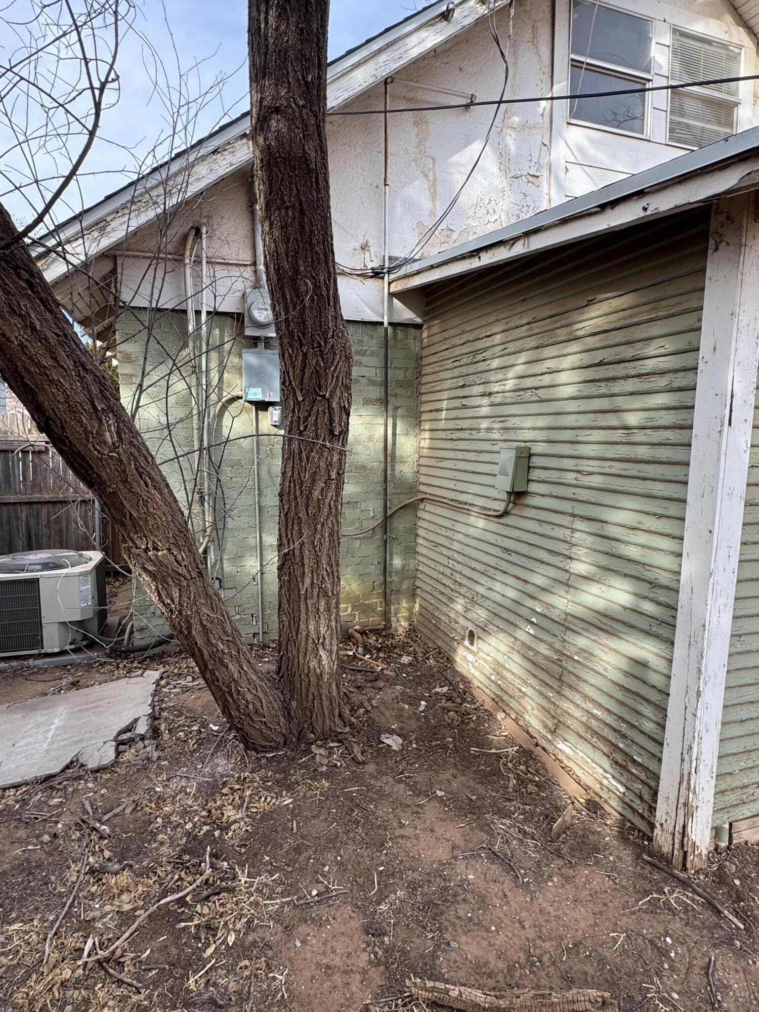 2119 26th Street Lubbock, TX 79411 - Photo 12 of 15 a pathway of a house with a yard