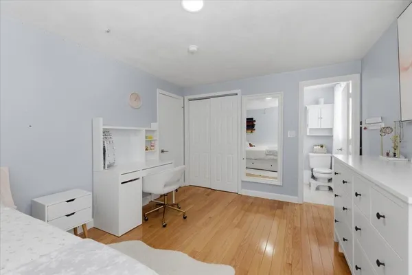 a room with a bed and furniture