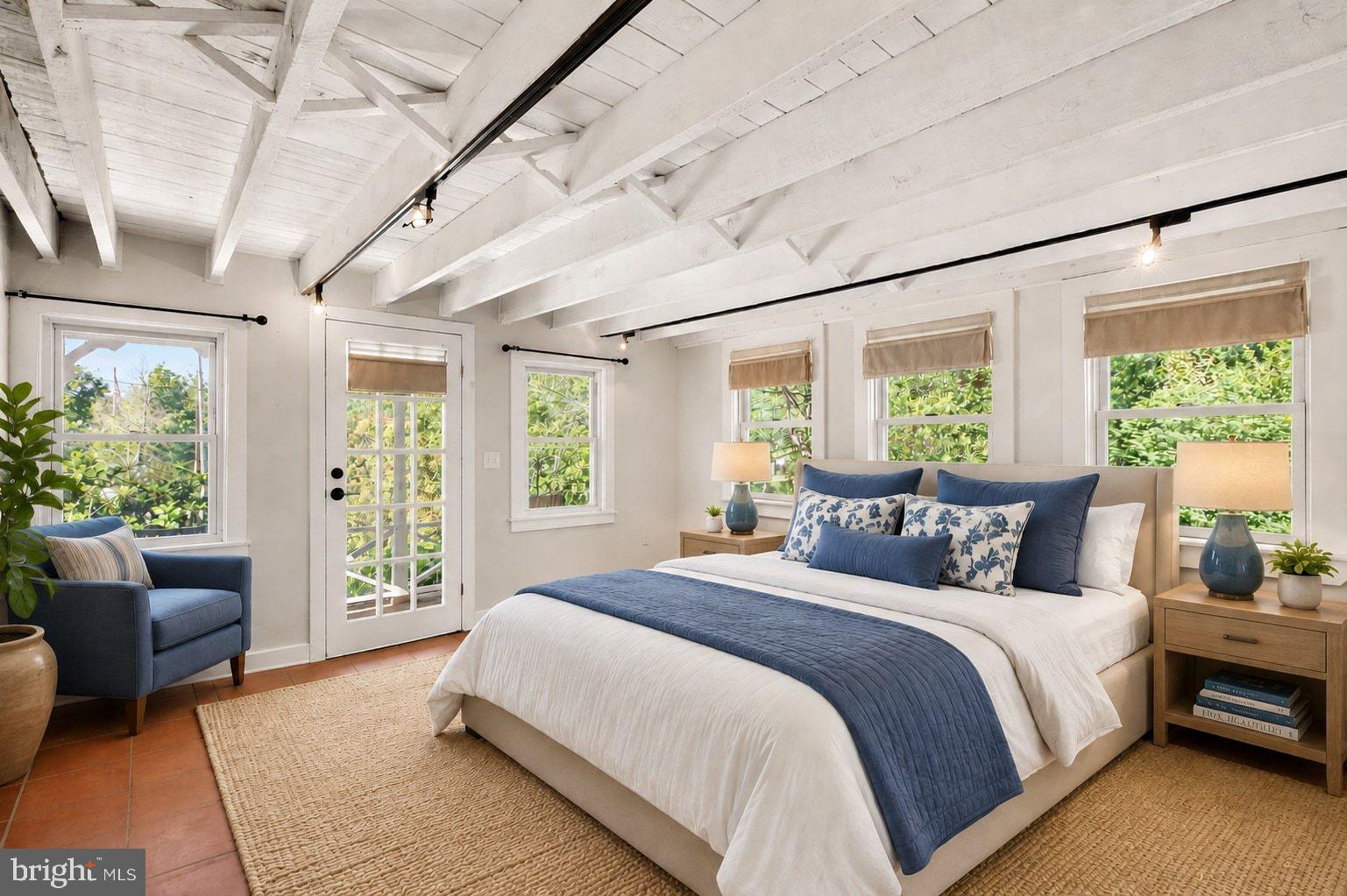 498 Perrineville Road Robbinsville, NJ 08691 - Photo 25 of 59 a bedroom with a balcony a bed and a couch