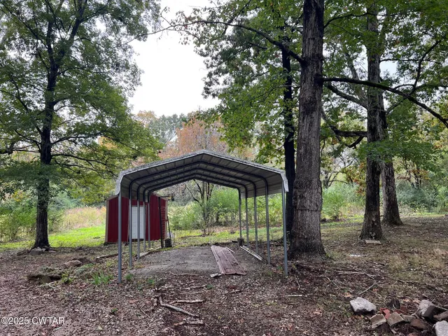a view of outdoor space with lots of trees