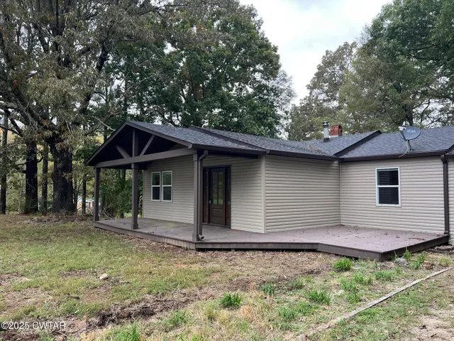 a backyard of a house with lots of green space