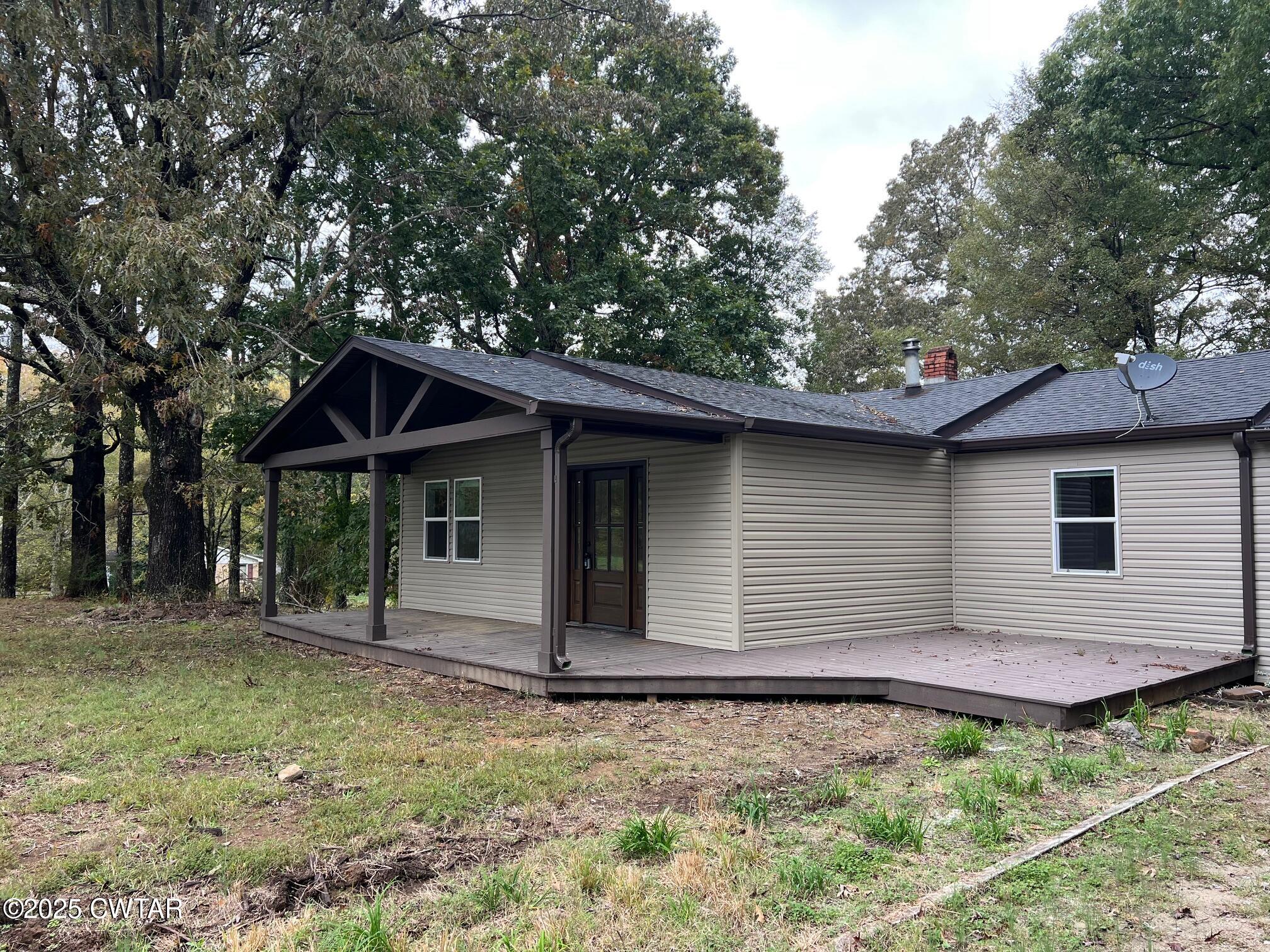 2215 Old Jacks Creek Road Henderson, TN 38340 - Photo 17 of 19 a backyard of a house with lots of green space