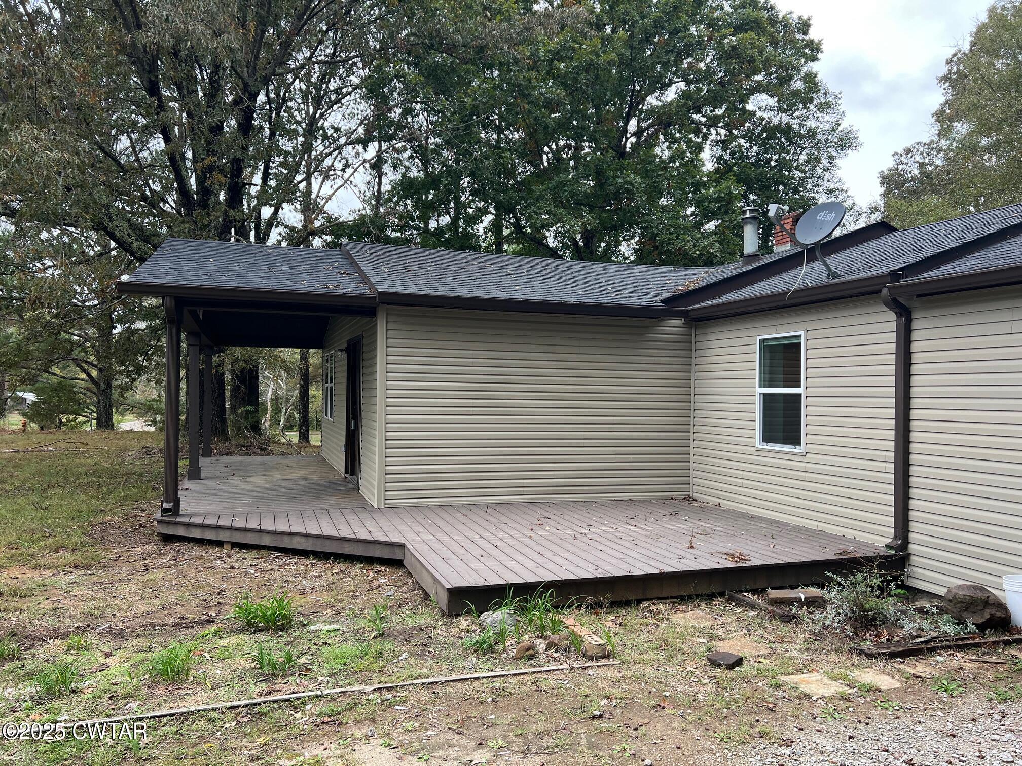 2215 Old Jacks Creek Road Henderson, TN 38340 - Photo 19 of 19 a front view of a house with garden