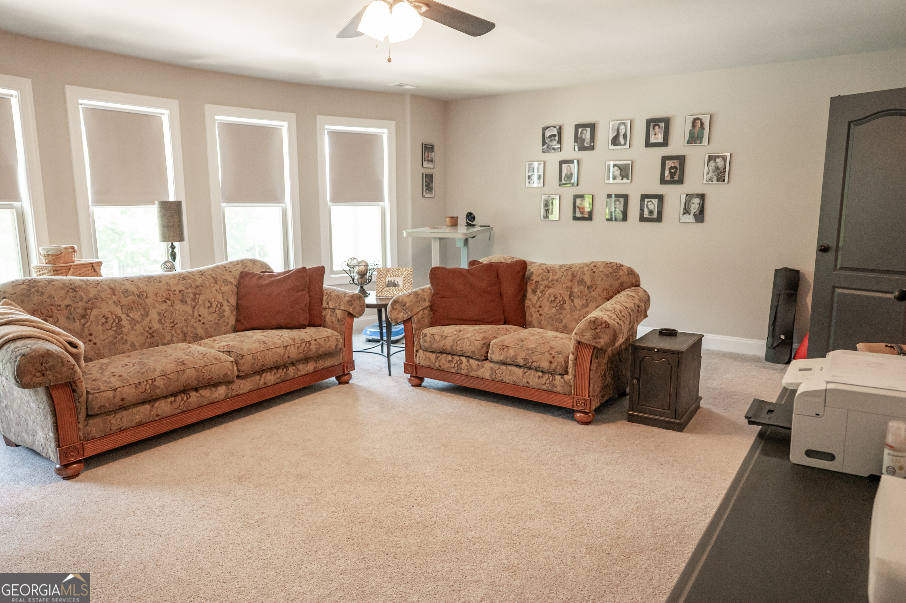 415 EAS Way Fayetteville, GA 30215 - Photo 36 of 70 a living room with furniture and a flat screen tv