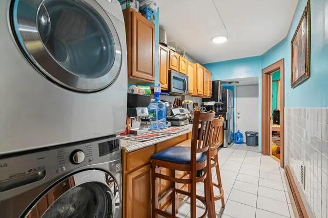 a view of a storage & utility room with washer and dryer