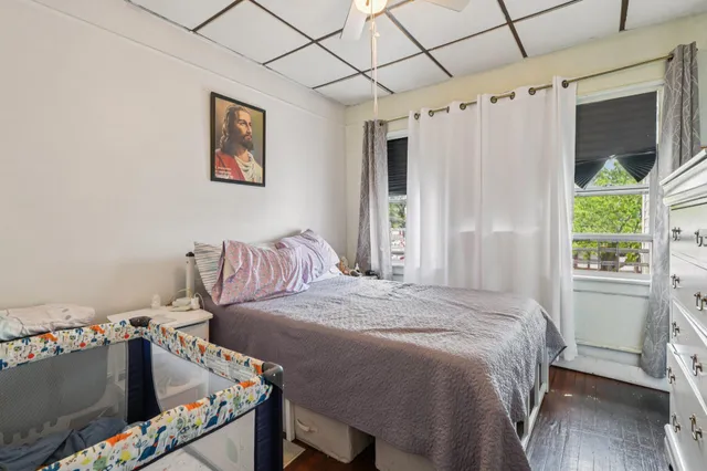 a bed room with a bed and a window