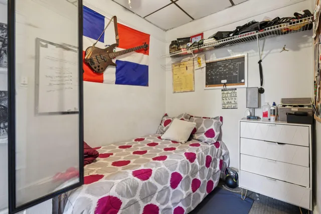 a bedroom with a bed and a cabinets