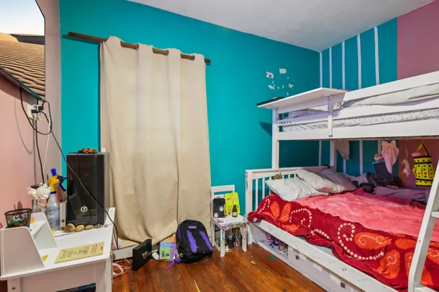 a bed room with a bed and a desk