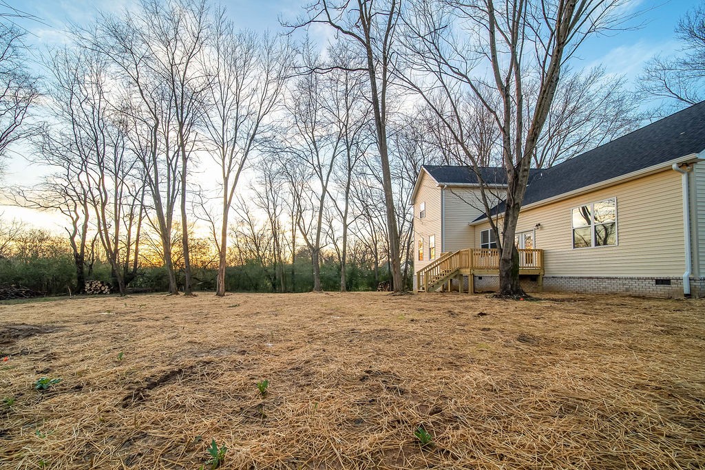 350 Fountainhead Road Portland, TN 37148 - Photo 33 of 36 a view of a black white house with a large tree