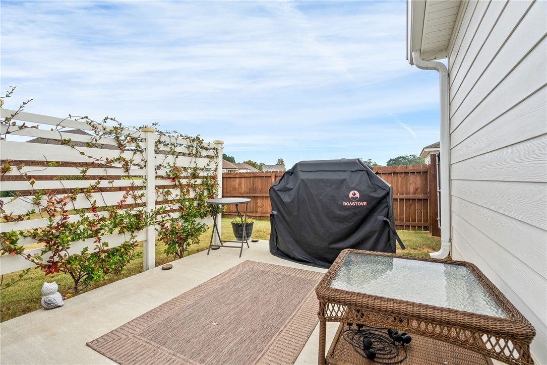 386 Bush Creek Road Opelika, AL 36804 - Photo 23 of 30 And MORE room - grill, play cornhole, add more seating and dining...skies the limit. Lattice vine fence provide additional privacy while still seeing into the backyard to watch those playing out on the grass.