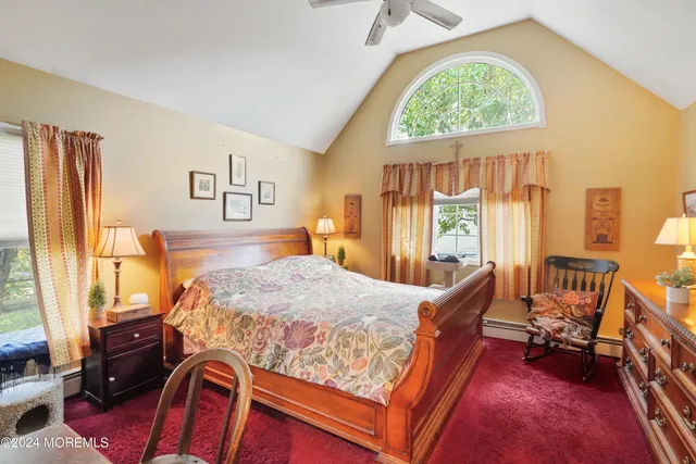 a bed room with a bed and a window