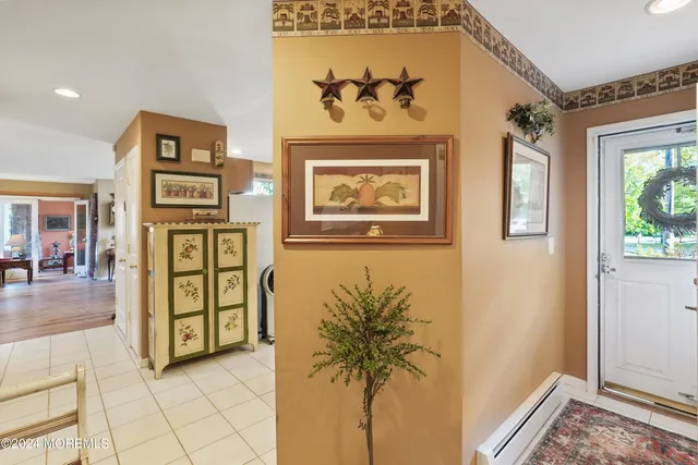 a view of a entryway with a hallway