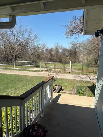 a view of swimming pool from a balcony