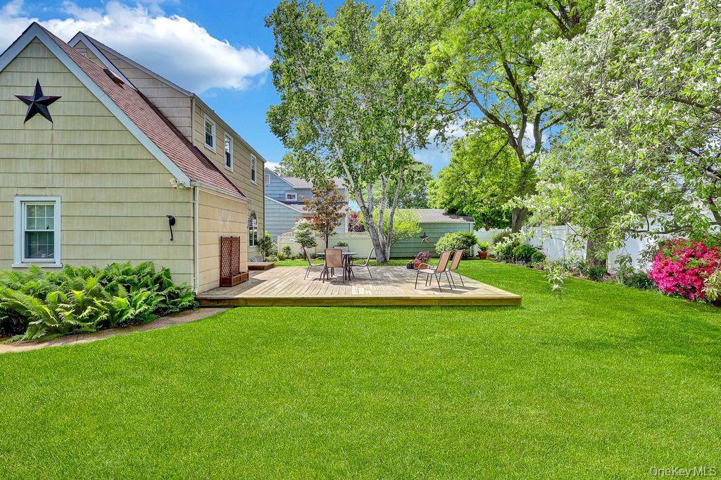 5 Newell Road Merrick, NY 11566 - Photo 18 of 19 a view of a house with backyard and sitting area